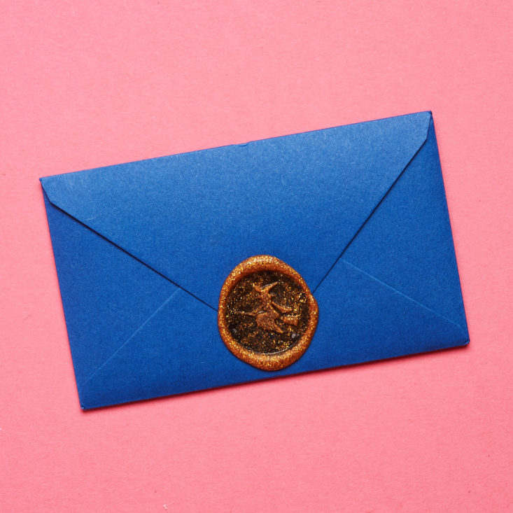 Postmarkd Studio bright blue envelope with seal