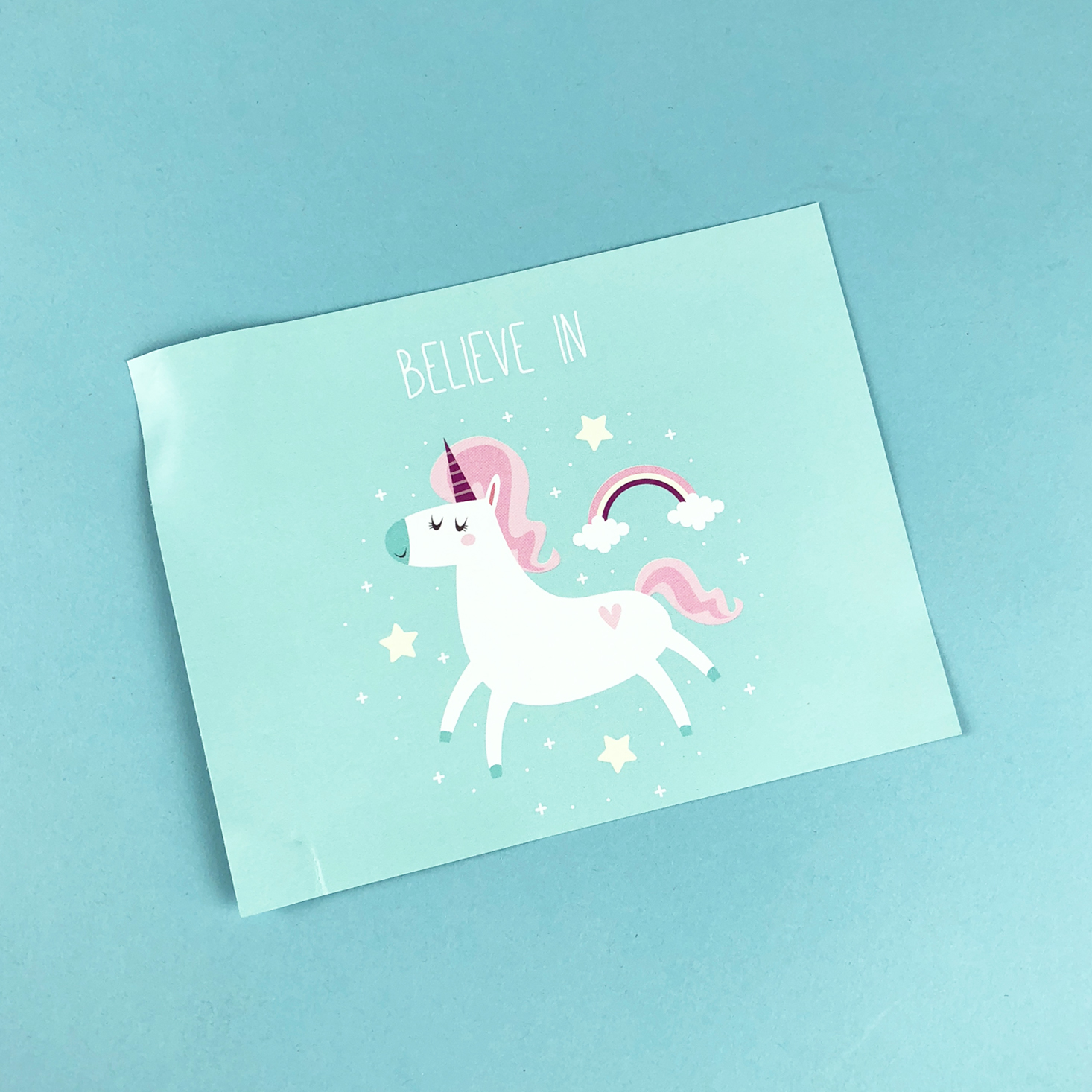 aqua info card with unicorn