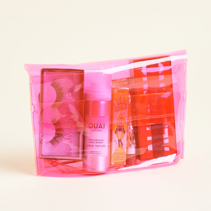 pink allure pouch filled with goodies