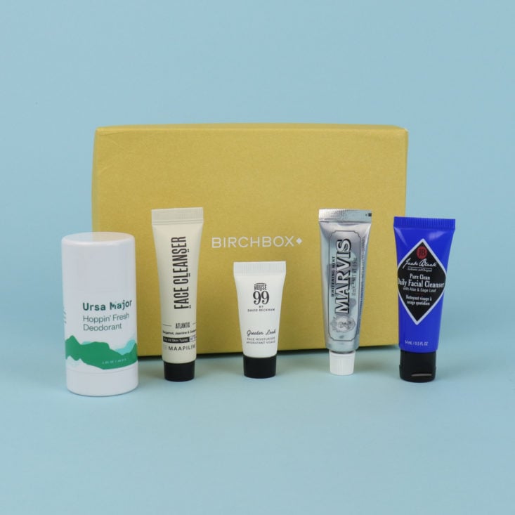 Birchbox Grooming subscription with all items unpacked, featuring deodorant, face cleanser, and other men's toiletries..
