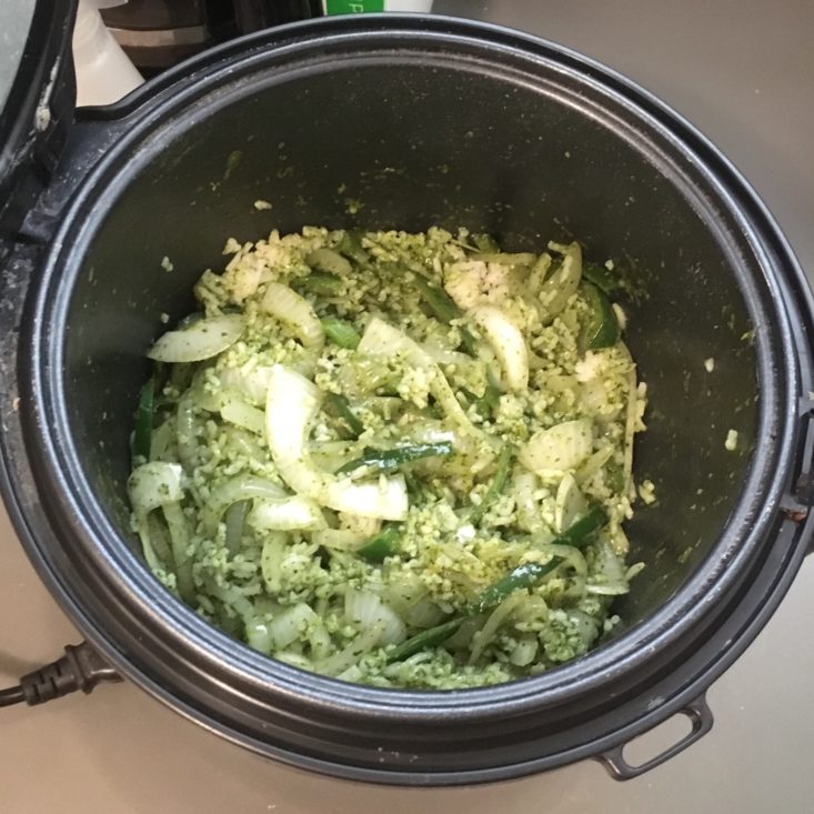 rice mixed with cilantro sauce and veggies