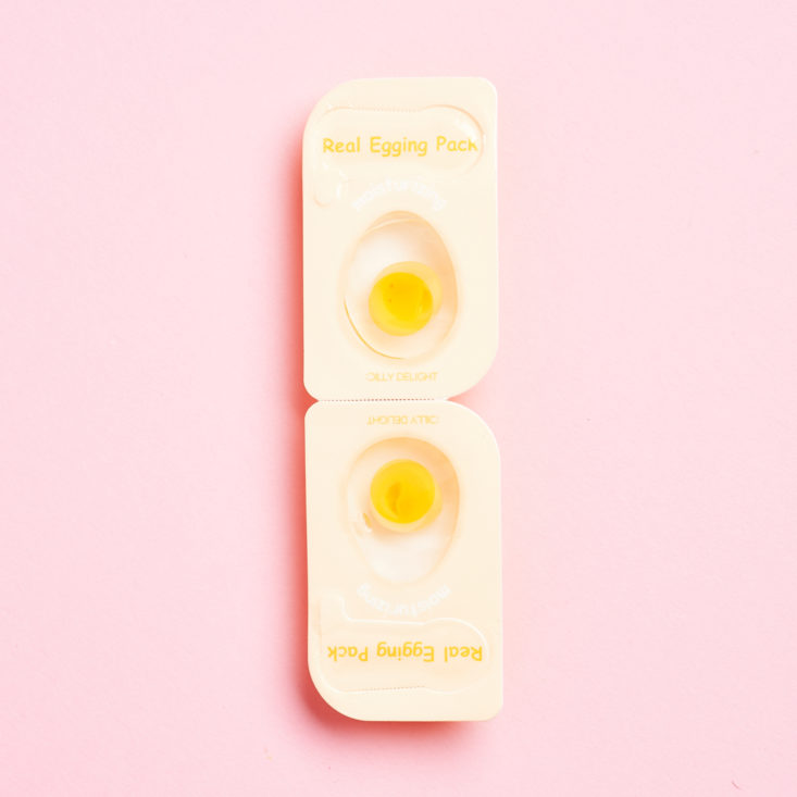 clear packaging on mask shows the clear and yellow egg themed mask
