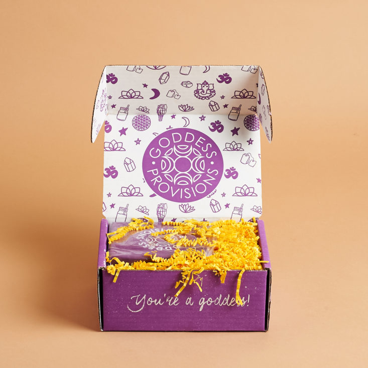 open purple box with yellow sizzle