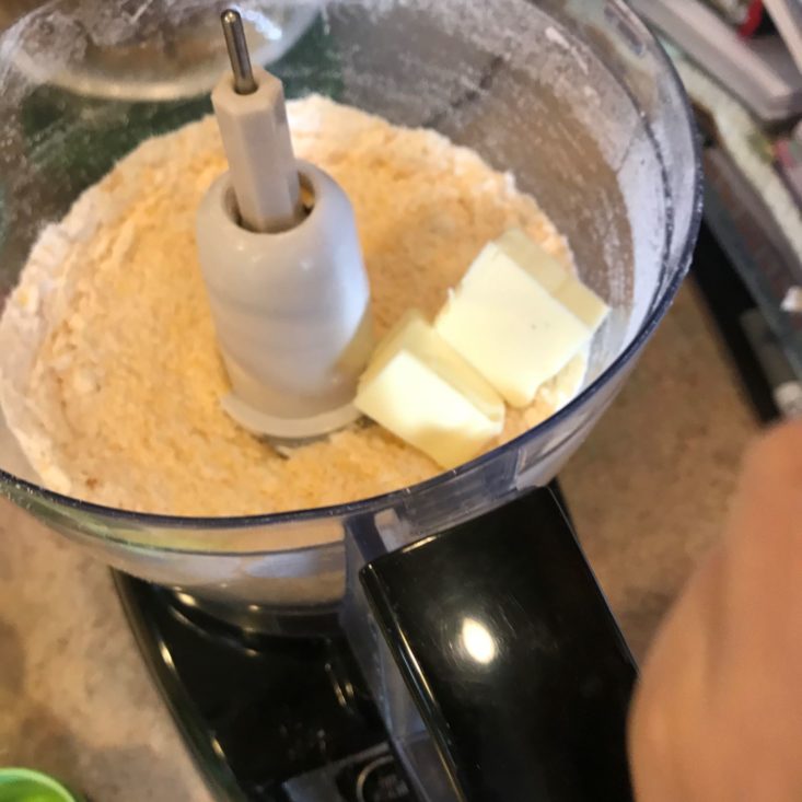 Young Chef's Club November 2019 adding butter to goldfish