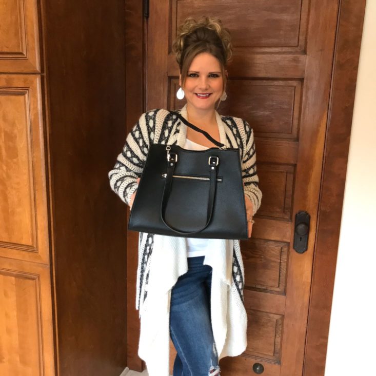 Bolzano November 2019 modeling purse holding it up